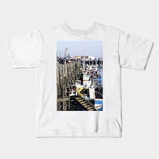 Fishing boats moored along Scarborough sea front, Yorkshire, UK Kids T-Shirt